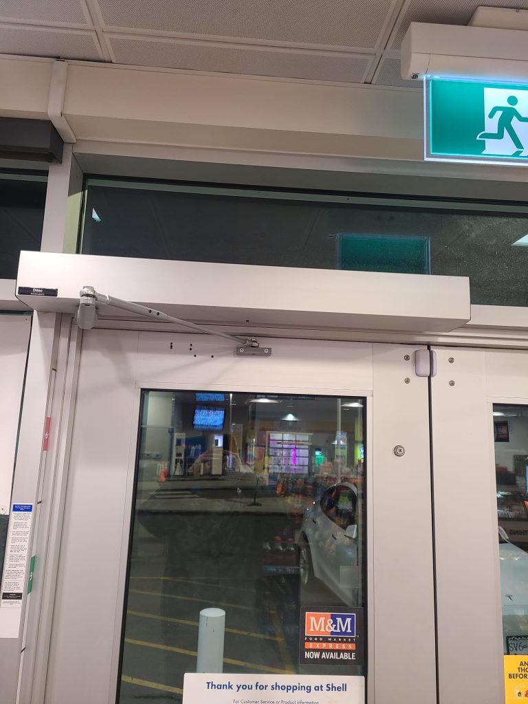 ditec ha8 automatic door operator installed on a commercial door